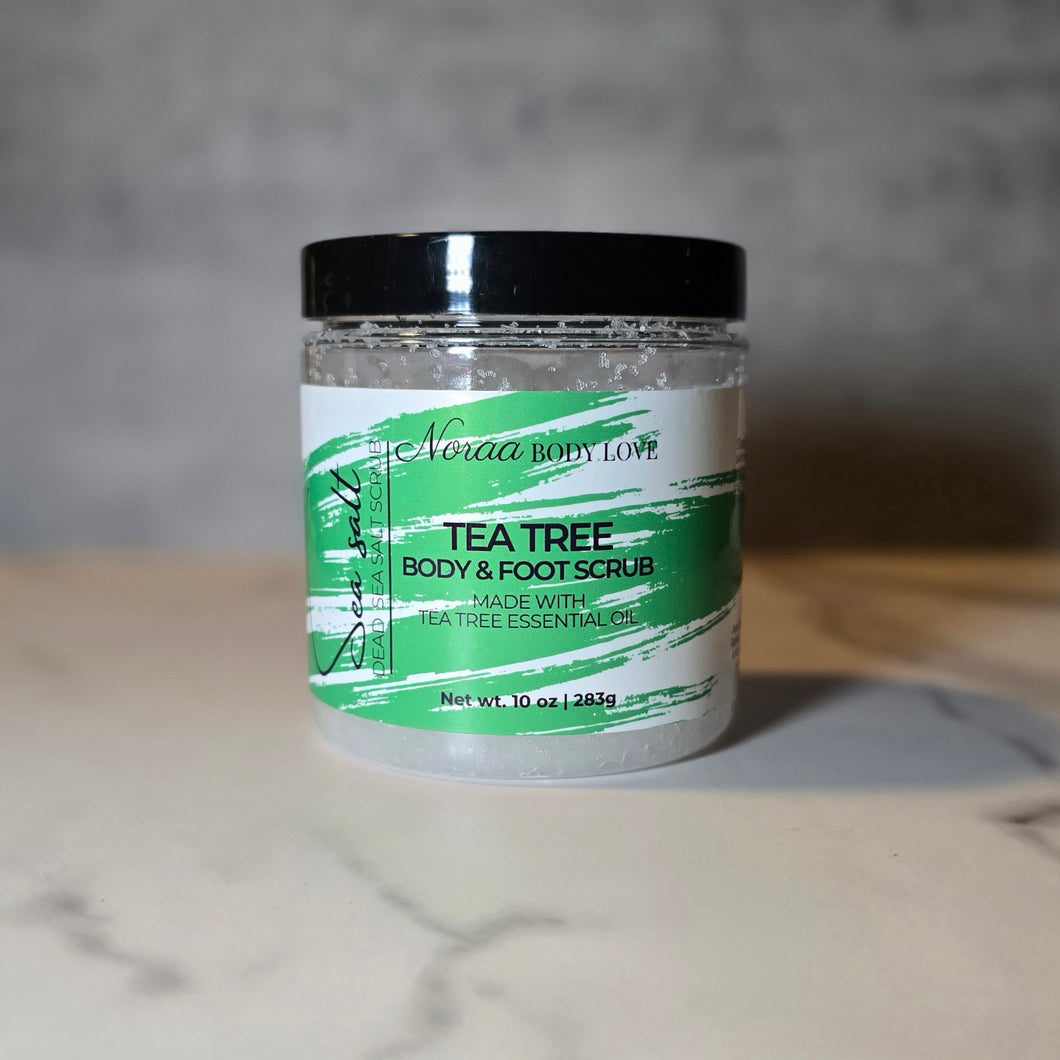 Jar of tea tree body scrub tea tree body scrub with green label on a neutral background